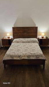 a bedroom with a large bed with two night stands at Apartamento Candombe in Montevideo