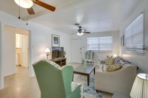 a living room with a couch and a table at New Orleans Area Home about 5 Mi to City Park! in Metairie