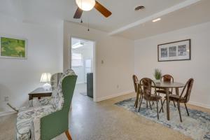 a dining room and living room with a table and chairs at New Orleans Area Home about 5 Mi to City Park! in Metairie