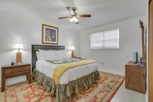 a bedroom with a bed and a ceiling fan at New Orleans Area Home about 5 Mi to City Park! in Metairie
