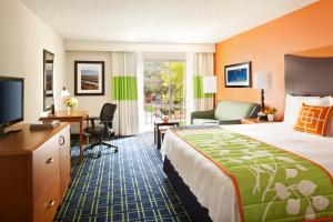 a hotel room with a bed and a desk at The Querque Hotel in Albuquerque