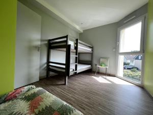 Postel nebo postele na pokoji v ubytování Accès direct plage 100m