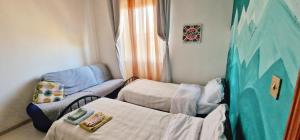 a hospital room with a bed and a chair at A dieci minuti dal centro - accogliente spazioso in Perugia +55 photos