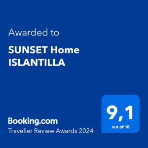 a blue sign with the text awarded to sunset home is islandelia at SUNSET Home ISLANTILLA in Islantilla