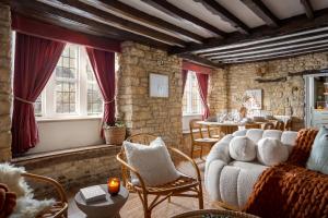 a living room with a couch and chairs and a table at Bourton Newly Remodeled Scandi Chic Authentic Charm & Character in Bourton on the Water