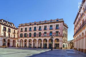 a large building in the middle of a street at Apartamento San Antón in Huesca