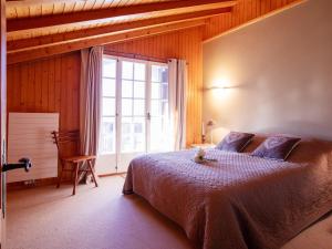 Ένα ή περισσότερα κρεβάτια σε δωμάτιο στο Apartment Le Mont Blanc 14 by Interhome