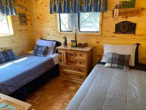 A bed or beds in a room at LilyBear Cabin