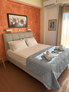 Postel nebo postele na pokoji v ubytování Vladimiros Apartments