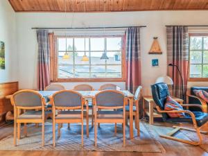 a dining room with a table and chairs at Holiday Home Teerenpesue e 37 by Interhome in Saariselka