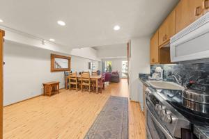 a kitchen with a table and a dining room at Palisades Tahoe Lodge Rentals Studio Loft #315 in Olympic Valley