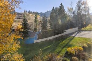 a house on a hill with a fence at Palisades Tahoe Lodge Rentals Studio Loft #314 in Olympic Valley