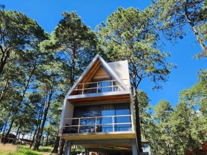 a tree house in the middle of a forest at Le Petite Chalet Mazamitla in Mazamitla