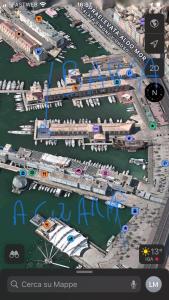 a map of a harbor with a ship and a boat at Barca americana old style refittata in Genova