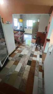 a kitchen with a checkered floor in a room at Recanto da preguiça in Igaratá