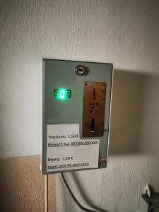 a lightswitch on a wall in a room at Landhaus Herdt in Lauda-Königshofen