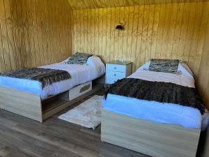 Postel nebo postele na pokoji v ubytování AncudLodge