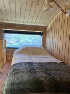Postel nebo postele na pokoji v ubytování AncudLodge