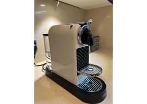 a toaster sitting on a stand on a kitchen counter at FAIRYTALE BELGRAVIA HOUSE - 2 beds 2 baths 4 people in London