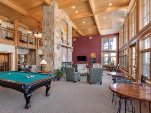 a large room with a pool table in it at Grand Timber Lodge 3 bedroom - Ski-in/Ski-out in Breckenridge
