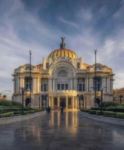 a large building with a dome on top of it at Modern Studio, Rooftop Charm, CDMX Center2 in Mexico City +36 photos