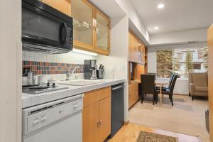 a kitchen with a sink and a stove top oven at Studio #234 in Olympic Valley