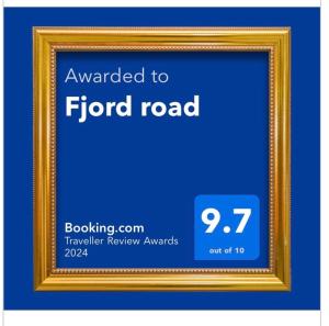 a gold picture frame with the words awarded toford road at Fjord road in Hjelmeland