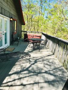 a patio with a table and chairs on a house at Robin's Roost in Sevierville