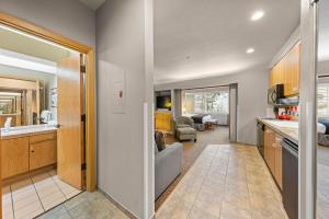 a kitchen and living room with a couch and a table at Studio #255 in Olympic Valley