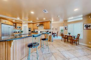 a kitchen with a bar and a dining room at Bay Park Villa in San Diego