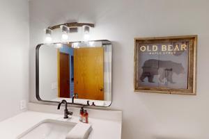 a bathroom with a sink and a mirror at Snow Flower 101 in Steamboat Springs