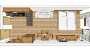 a floor plan of a tiny house with a bed and cabinets at Garni Stefani in Vent