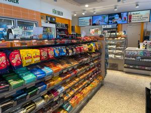 a store aisle with a large display of food at Rasta Falköping in Falköping