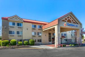 a front view of a hotel with a carolina inn at Comfort Inn Layton - Salt Lake City in Layton
