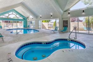 a swimming pool in a building with two pools at Comfort Inn Layton - Salt Lake City in Layton