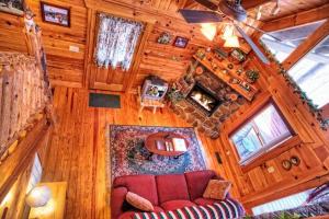 an overhead view of a living room in a log cabin at Mick's Hideaway - Semi-Secluded in Sevierville