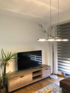 Televisyen dan/atau pusat hiburan di APARTAMENTO MOAÑA - PLAYA A XUNQUEIRA