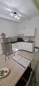 a kitchen with a wooden table with a plate on it at LUCA apartment 5H in Noord