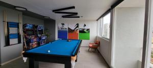 a billiard room with a blue pool table at Vive Alto Reñaca in Viña del Mar