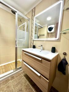 a bathroom with a sink and a shower at Iguazu I Yumbo Third Floor Apartment in Playa del Ingles