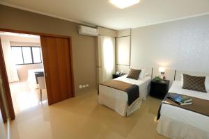 Cama ou camas em um quarto em Nadai Confort Hotel e Spa