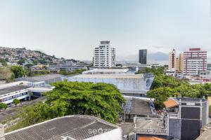 an overhead view of a city with buildings and trees at Apto confortável vista mar em Floripa EVA704 in Florianópolis