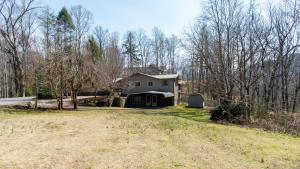 a house in the middle of a field at Little Smoky Retreat , 3 Bedroom , Close to downtown Gatlinburg AND Pigeon Forge in Gatlinburg