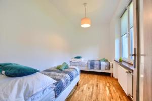 Posteľ alebo postele v izbe v ubytovaní Apartament Michalina