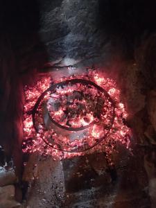 a fire pit with red lights on the ground at Art House Old Village in Jesenice