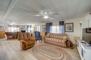 a living room with a couch and a chair at Pet-Friendly Camp Verde Home Hiking, Wine and More! in Camp Verde