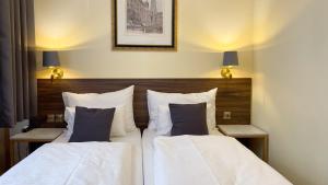 Letto o letti in una camera di Private Comfort STEPHANSPLATZ - SELF CHECK IN