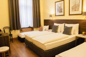 Letto o letti in una camera di Private Comfort STEPHANSPLATZ - SELF CHECK IN