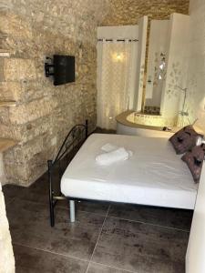 a bedroom with a bed in a room with a mirror at Maison Carolina in Vieste