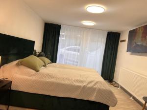 Postel nebo postele na pokoji v ubytování Apartman Liška